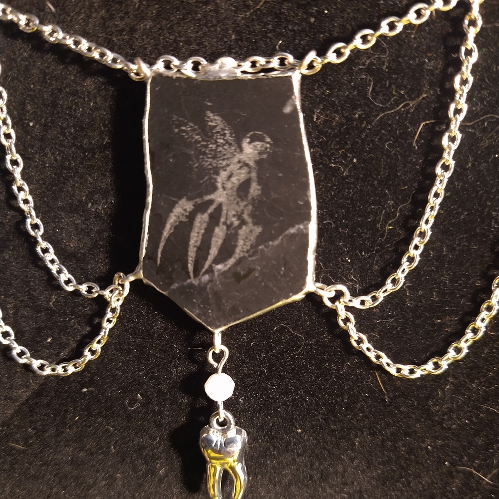 Hell Boy Tooth Fairy necklace